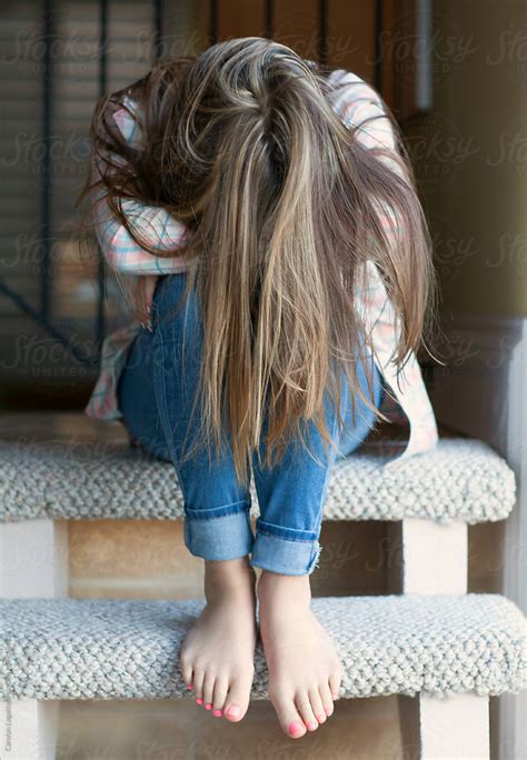 teenage girl  long hair head  hiding  face  stocksy contributor carolyn