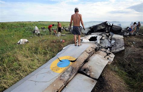 ukrainian military plane  shot   russia adds  presence  border   york times