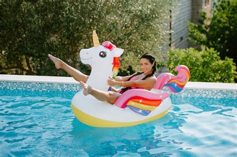 Premium Photo Sexy Woman Lay On Inflatable Beach Floaty Toy Unicorn