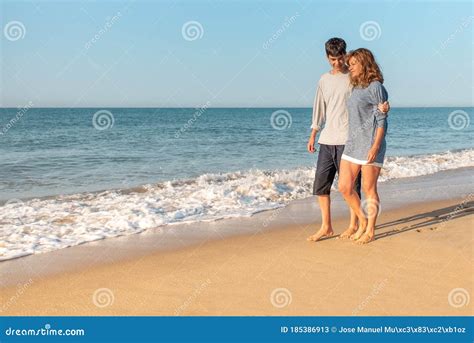 mother  son talking  walking   beach stock image image