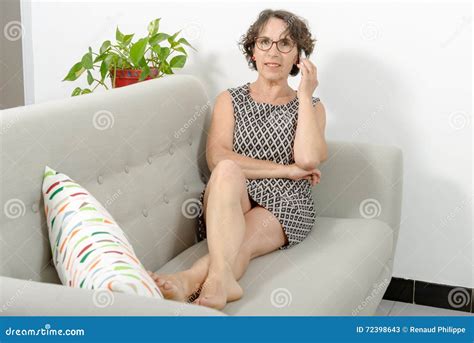 Mature Woman On The Sofa With A Phone Stock Image Image Of Relaxation