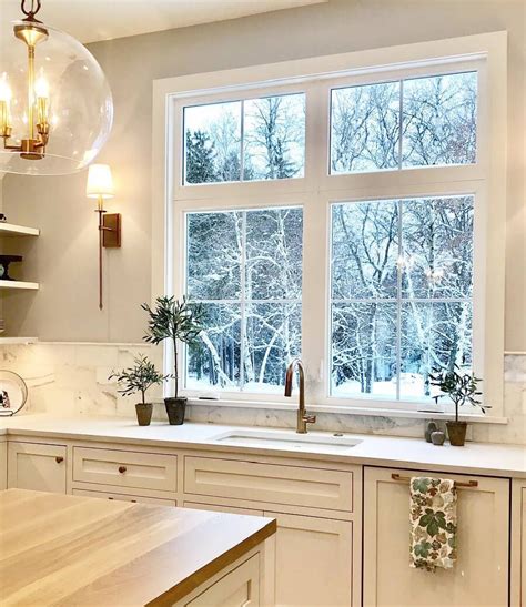 white casement windows brighten farmhouse style kitchen pella
