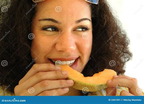 young woman   cantaloupe stock image image  african appetite