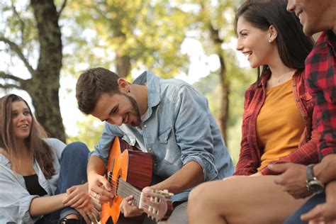 friends spending time   guitar  stock photo