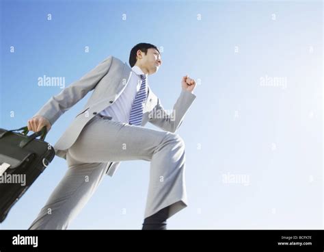 running businessman high resolution stock photography  images alamy