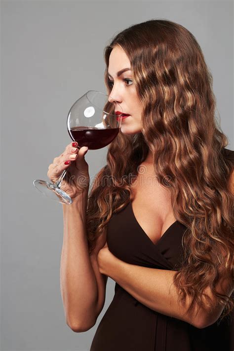 girl with glass of red wine beautiful blond woman drinking red wine