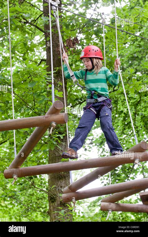 Girl 8 Years Climbing At Hochseilgarten High Ropes Course Straubing