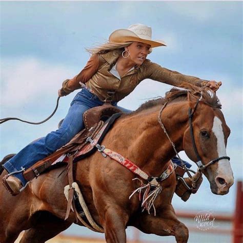 woman riding      brown horse