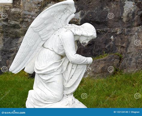 praying angel   knees stock photo image  closeup