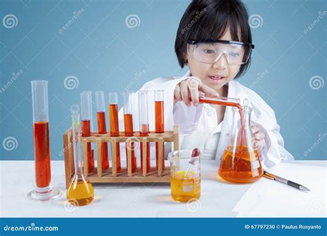 scientist mixing  chemical fluid stock photo image  chemical flask