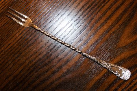 antique niagara falls  silver plate long twist handle pickle olive