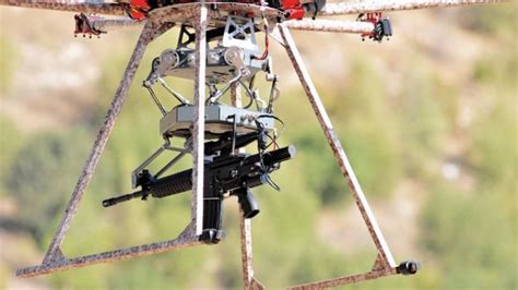 firm reveals gun toting drone   fire  mid air arcom