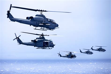 ah  super cobra  uh  huey helicopters fly  formation  maintenance  readiness
