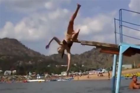 bikini clad girl s epic fail as she attempts to perform sexy dive off