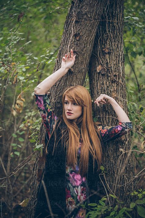 woman posing by the tree by mosuno