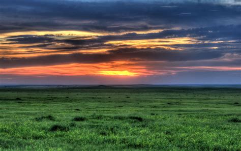 sunset   grassland  badlands national park south dakota image