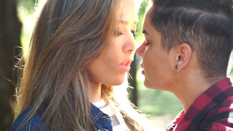 romantic lesbian couple kissing on a sunset time ~ video 84306015