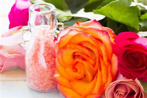 spa  wellness setting  rose flower sea salt oil   bottle