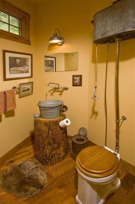 rustic high tank toilet  galvanized bucket sink rustic bathroom