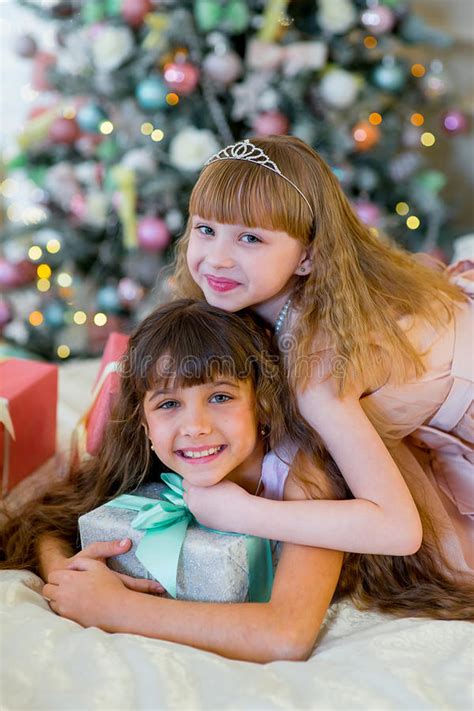 Two Adorable Girls With Christmas Ts Stock Image Image Of Indoor