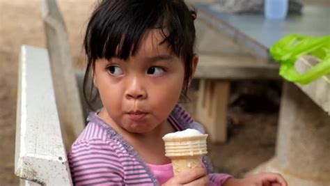 Cute Asian Girl Enjoys Delicious Ice Stock Footage Video 100 Royalty