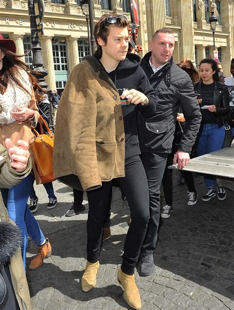 spotted harry styles in a saint laurent shearling coat