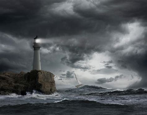 lighthouse shining  stormy ocean photograph  john  lund photography  fine art america