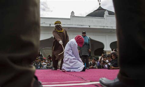 women wait in queue to be caned in public for unmarried sex in indonesia