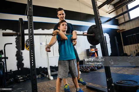 Father And Son Working Out At Gym Photo Getty Images