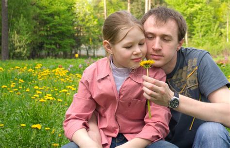 the father and the daughter on a green meadow stock image image of