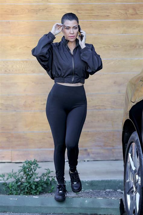 kourtney kardashian wore a black cropped jacket and black