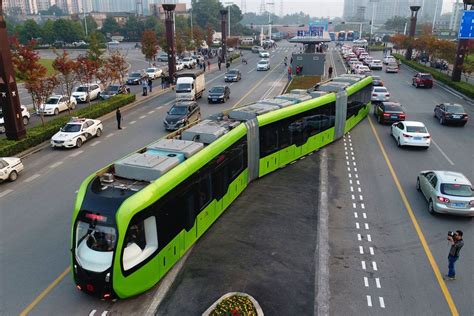 china s autonomous “rail bus” uses sensors to move along a road curbed