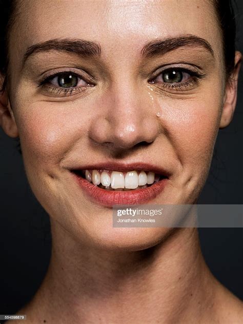 Woman Smiling With A Tear Running Down Her Face Photo Getty Images