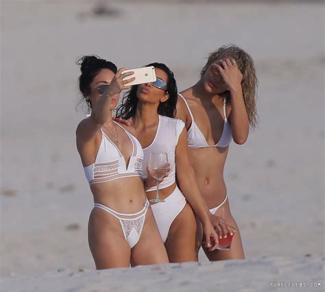 kim kardashian flashing her pussy and tits through wet white bikini