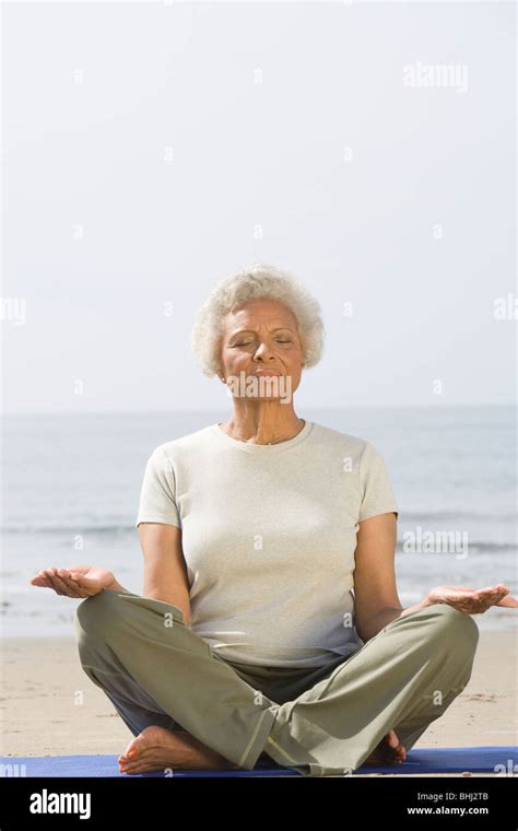 african american senior yoga outdoors  res stock photography