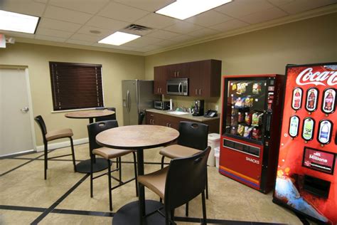 officesimple office break room ideas  small space  cream wall color  brown cabinet