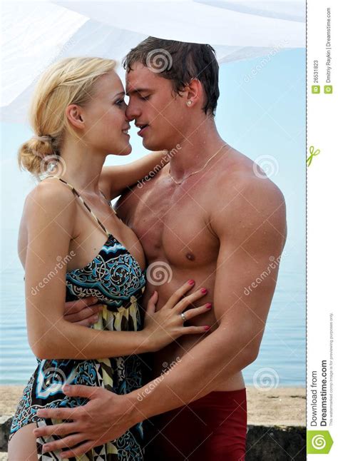 woman and man kissing at the beach stock image image of