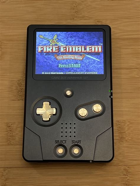gba sp unhinged  black  gold gameboy