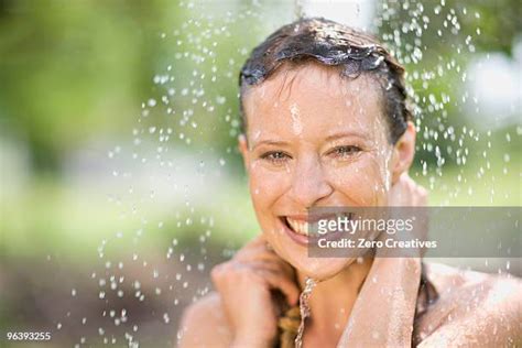 Taking An Outdoor Shower Photos And Premium High Res Pictures Getty