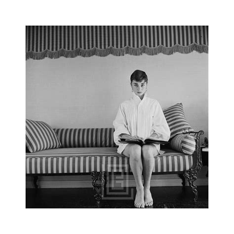 Mark Shaw Audrey Hepburn On Striped Sofa Faces Forward With Book