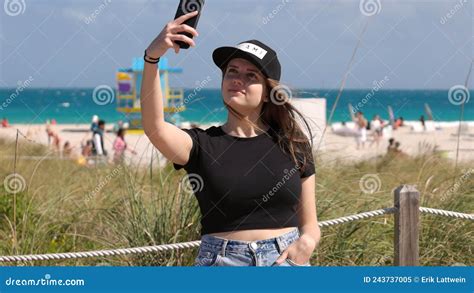 Pretty Woman At Miami Beach Takes A Selfie At The Beach Stock Image
