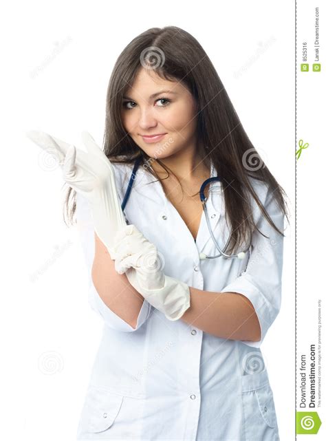 Doctor Putting On Sterile Gloves Royalty Free Stock Image