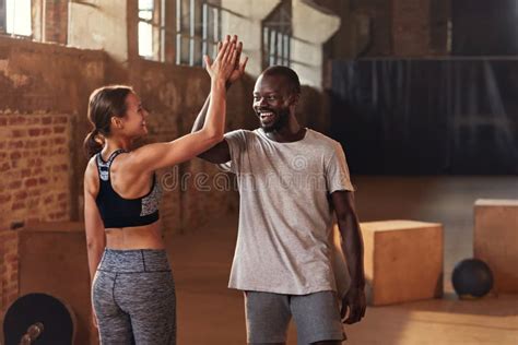 Sport Couple Giving High Five After Fitness Workout At Gym Stock Image