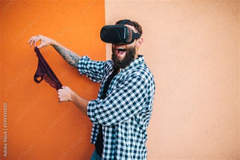 virtual sex concept man in vr glasses play cybersex games and holding