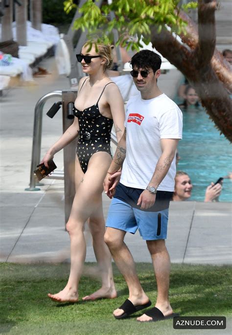 Sophie Turner Sexy In A Black Belted Swimsuit As She Was With Joe Jonas