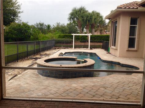 tropical landscaping  paver deck  small pool area