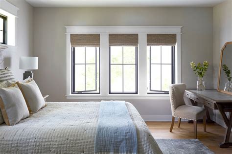 black windows  white trim  neutral colored bedroom