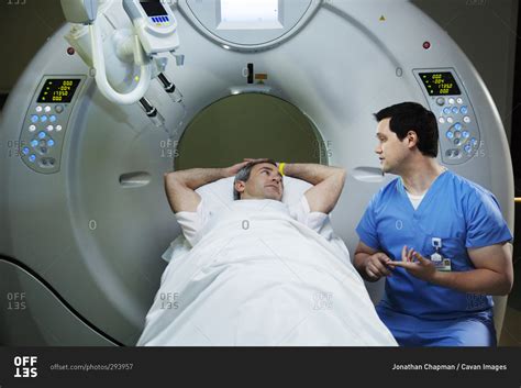 technician explaining ct scan procedure  patient stock photo offset