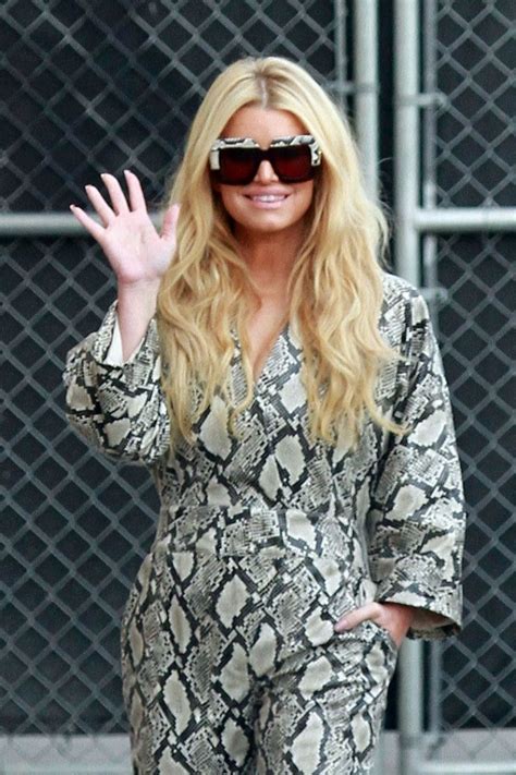 jessica simpson strikes a pose for photographers as she