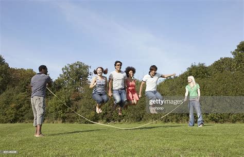 Group Portrait Of Friends Skipping Photo Getty Images